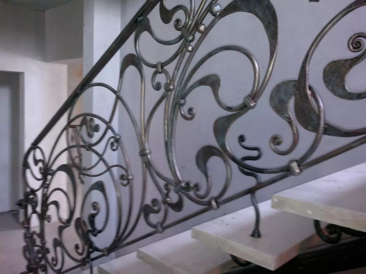 Brown interior wrougnt iron stair railing with gold and green patina of modern style 898