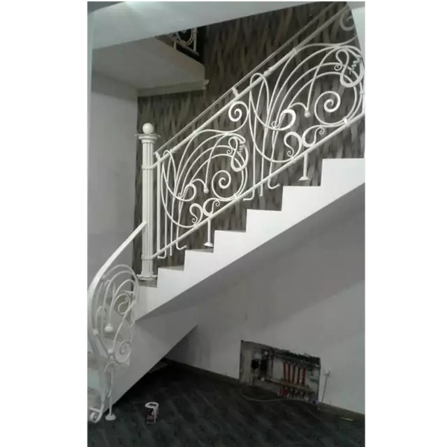 White interior wrought iron stair railing. 268