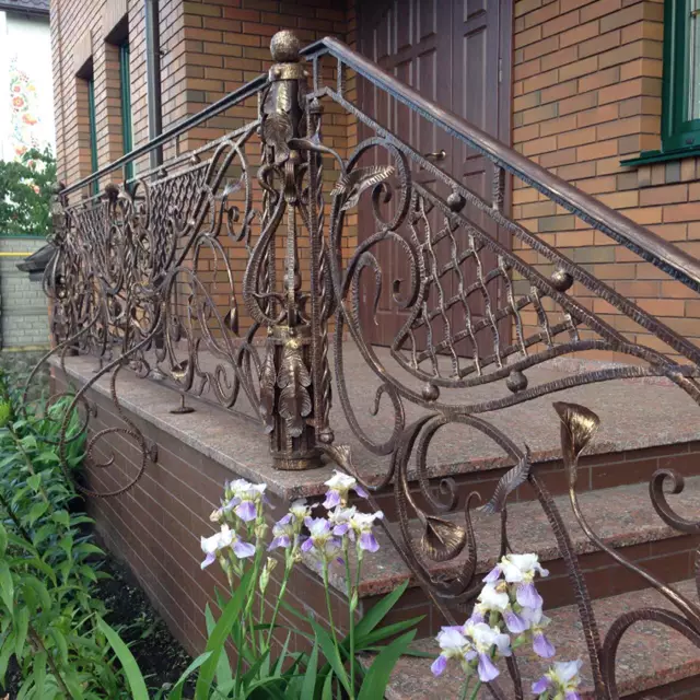 Exterior wrought iron porch railing with patina. 279